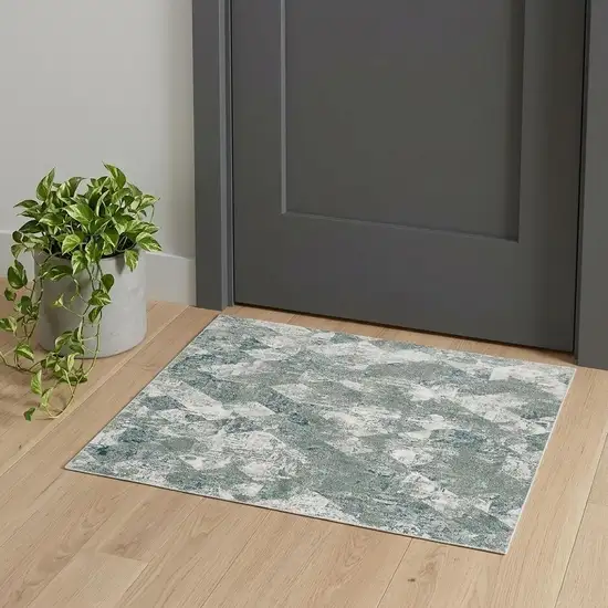 Green And Ivory Patchwork Distressed Stain Resistant Area Rug Photo 1