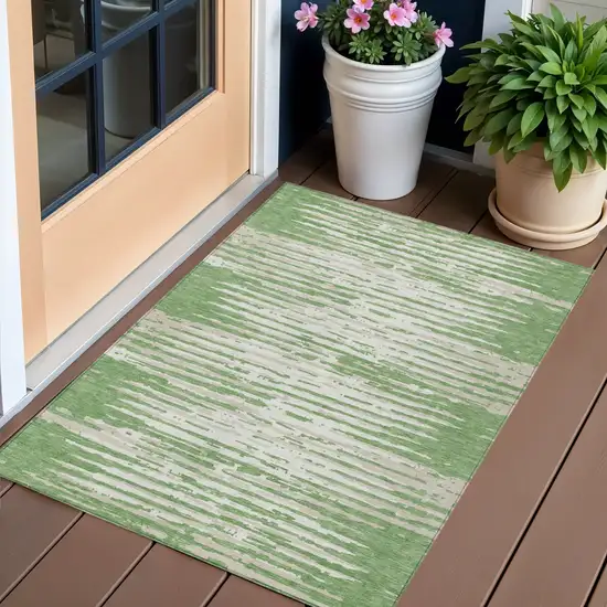 Green And Ivory Striped Washable Indoor Outdoor Area Rug Photo 1