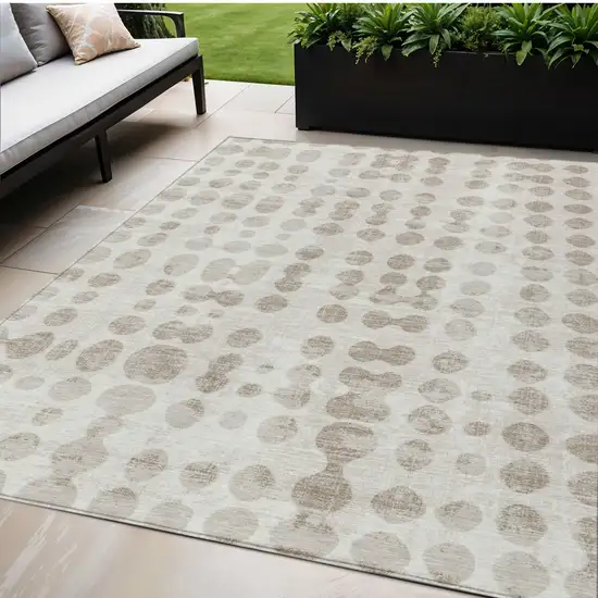 Ivory And Beige Abstract Washable Indoor Outdoor Area Rug Photo 1