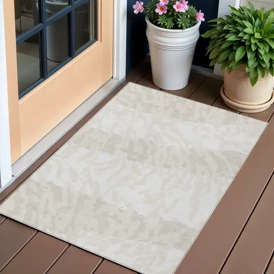 Ivory And Beige Animal Print Washable Indoor Outdoor Area Rug Photo 1