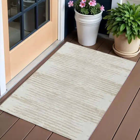 Ivory And Beige Striped Washable Indoor Outdoor Area Rug Photo 1