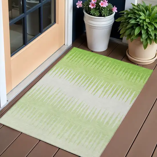 Lime Green And Ivory Striped Washable Indoor Outdoor Area Rug Photo 1