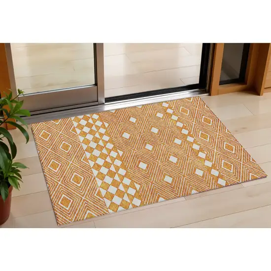 Orange And Ivory Geometric Washable Indoor Outdoor Area Rug Photo 1
