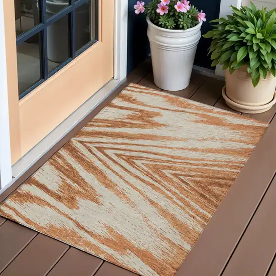 Orange Brown And Beige Abstract Washable Indoor Outdoor Area Rug Photo 1