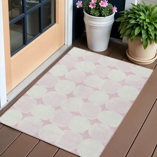 Pink And Ivory Abstract Washable Indoor Outdoor Area Rug Photo 1