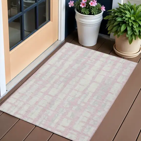 Pink Gray And Ivory Striped Washable Indoor Outdoor Area Rug Photo 1