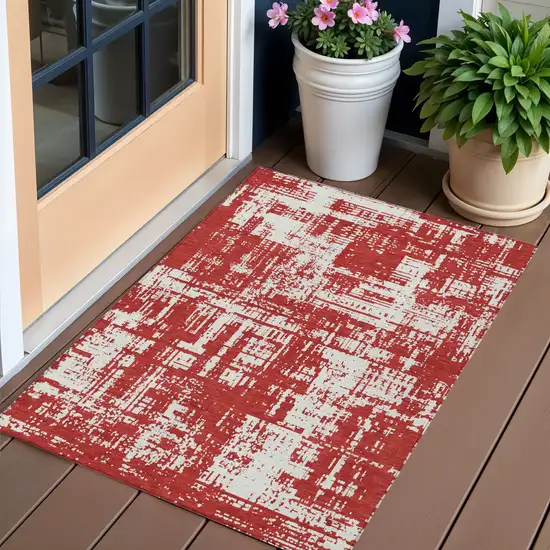 Red And Ivory Abstract Washable Indoor Outdoor Area Rug Photo 1