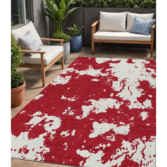 Red And Ivory Abstract Washable Indoor Outdoor Area Rug Photo 1