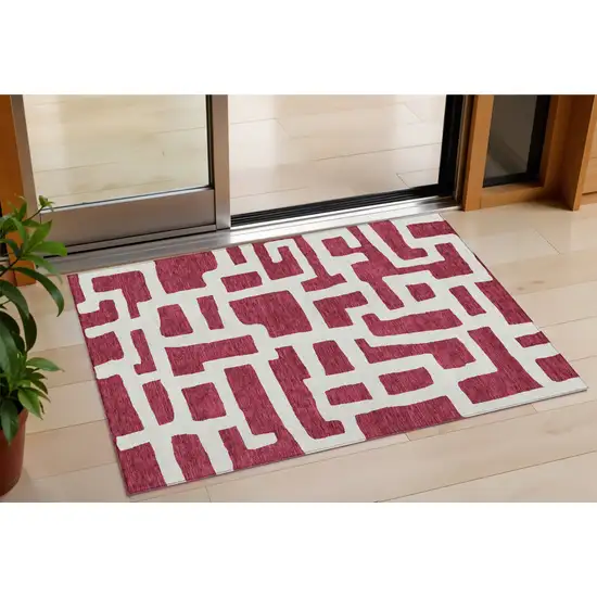 Red And Ivory Abstract Washable Indoor Outdoor Area Rug Photo 1