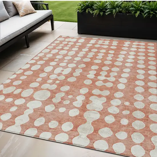 Salmon And Ivory Abstract Washable Indoor Outdoor Area Rug Photo 1