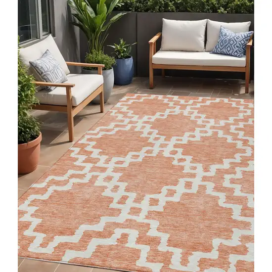 Salmon And Ivory Geometric Washable Indoor Outdoor Area Rug Photo 1