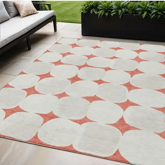 Salmon Beige And Ivory Abstract Washable Indoor Outdoor Area Rug Photo 1