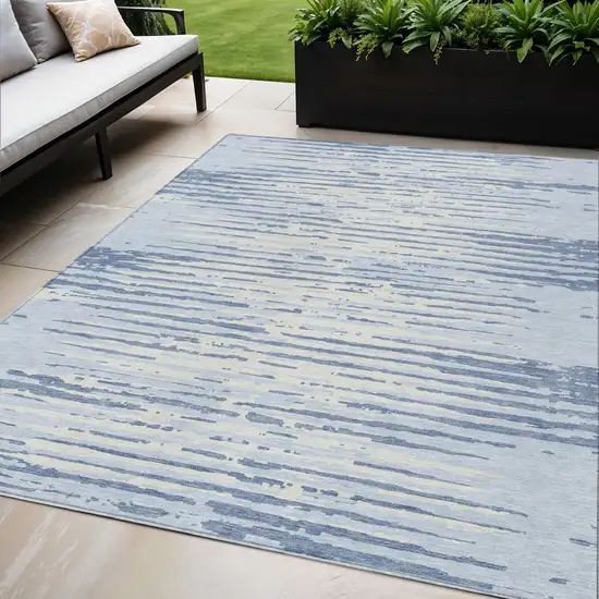 Sky Blue And Ivory Striped Washable Indoor Outdoor Area Rug Photo 1