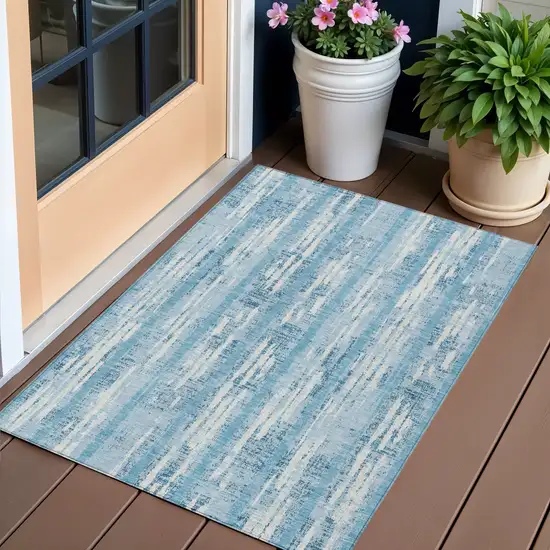 Sky Blue And Ivory Striped Washable Indoor Outdoor Area Rug Photo 1