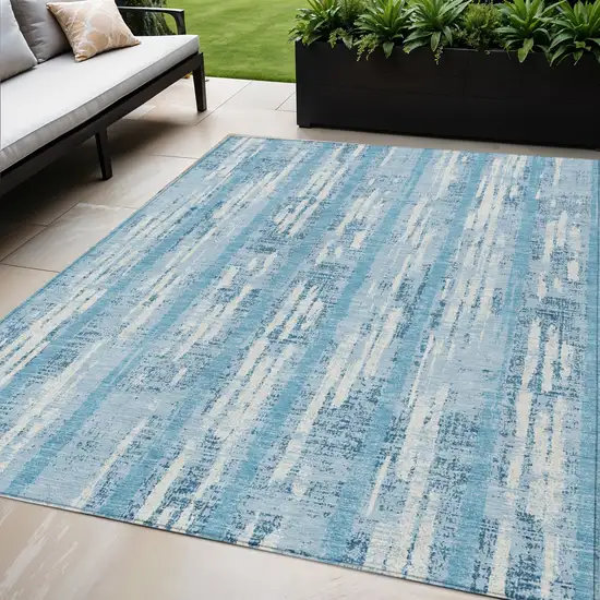 Sky Blue And Ivory Striped Washable Indoor Outdoor Area Rug Photo 1