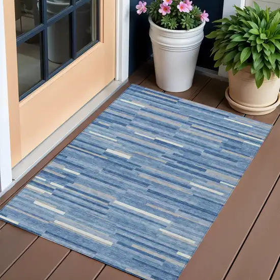 Sky Blue Gray And Ivory Striped Washable Indoor Outdoor Area Rug Photo 1