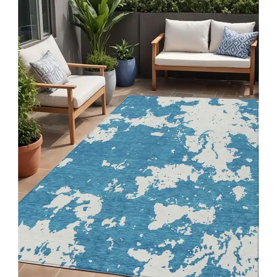 Teal Blue And Ivory Abstract Washable Indoor Outdoor Area Rug Photo 1