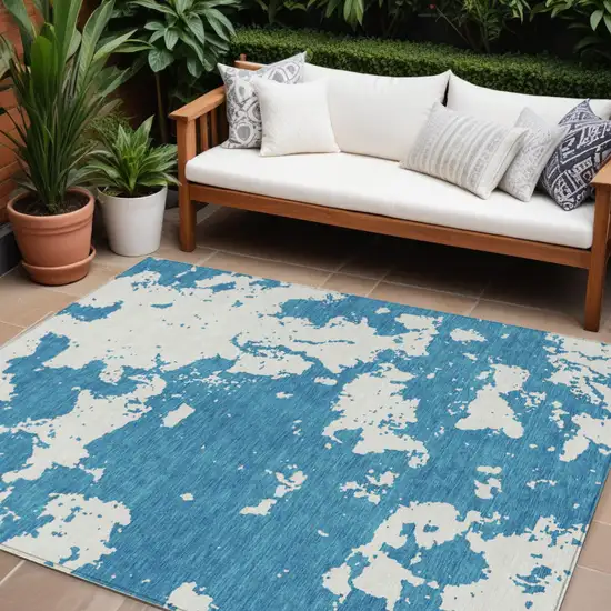 Teal Blue And Ivory Abstract Washable Indoor Outdoor Area Rug Photo 1