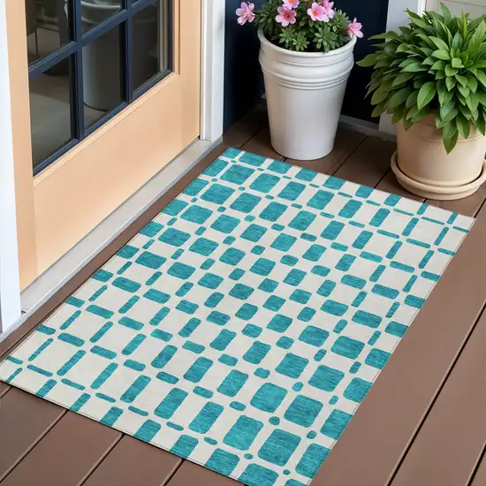 Teal Blue And Ivory Geometric Washable Indoor Outdoor Area Rug Photo 1