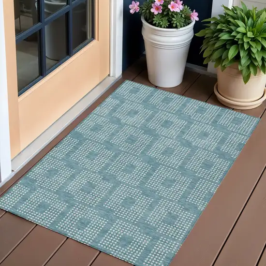Teal Blue And Ivory Geometric Washable Indoor Outdoor Area Rug Photo 1