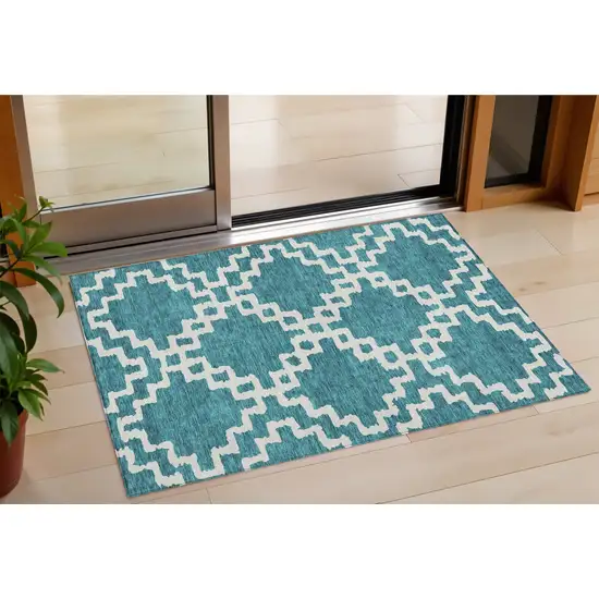 Teal Blue And Ivory Geometric Washable Indoor Outdoor Area Rug Photo 1