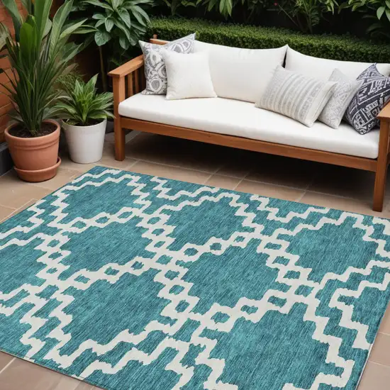Teal Blue And Ivory Geometric Washable Indoor Outdoor Area Rug Photo 1