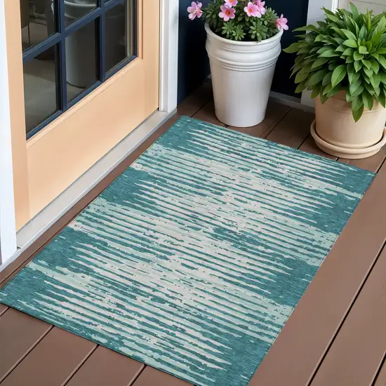 Teal Blue And Ivory Striped Washable Indoor Outdoor Area Rug Photo 1