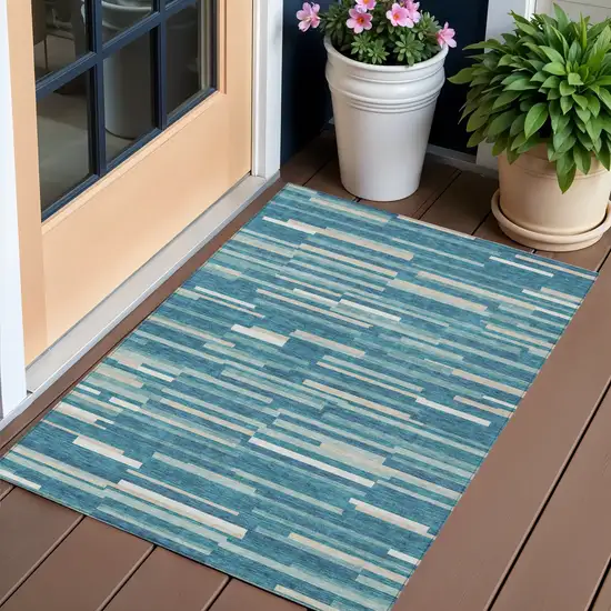 Teal Blue And Ivory Striped Washable Indoor Outdoor Area Rug Photo 1