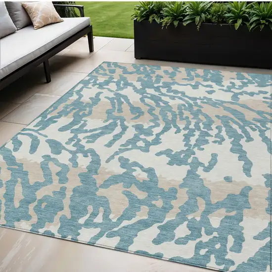 Teal Blue Beige And Ivory Animal Print Washable Indoor Outdoor Area Rug Photo 1